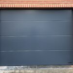 Porte de garage sectionnelle Wisniowski Manages – menuiseries extérieures